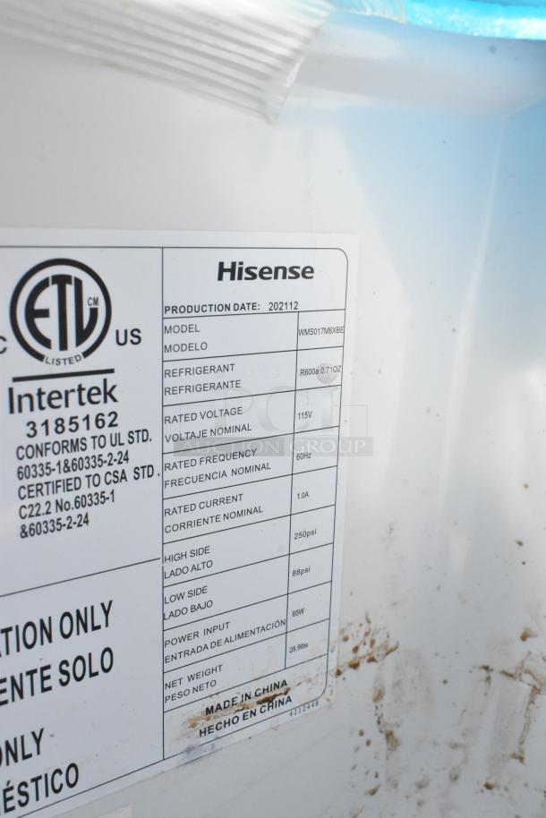 Hisense WMS017M6XBE Mini Cooler label details production date, model, refrigerant type, voltage, and power input.