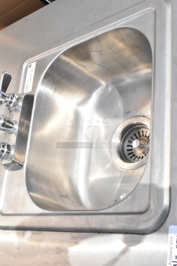 QualServ stainless steel portable sink with dual faucets, commercial casters; features BK label, minor wear.