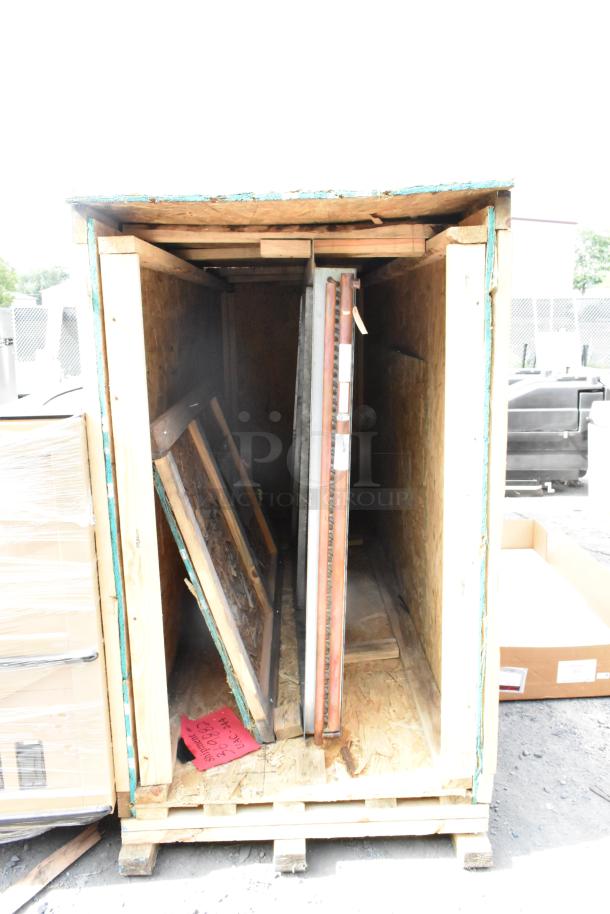 Brand new evaporator coil in crate, pristine condition, visible crate structure offers protection and easy transport.