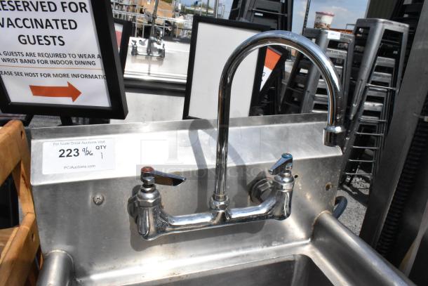 Stainless steel single bay sink with dual-handle faucet, used condition, auction tag indicates quantity 1, item 223.