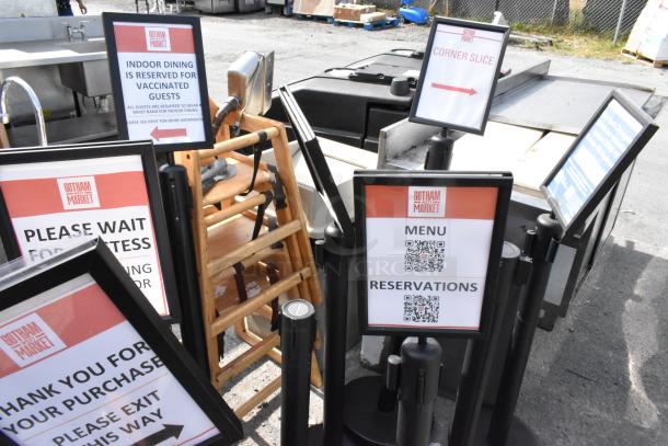 9 stanchions with signage from Gotham Market, featuring instructions for guests. Items are in good condition.