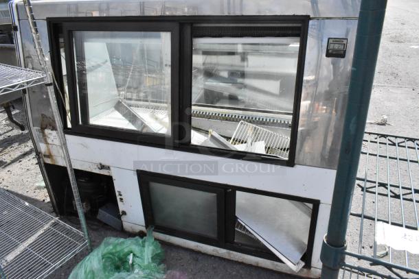 Marc Metal Commercial Floor Deli Display Case Merchandiser, showing exterior condition with visible wear, shelves inside, and control panel.
