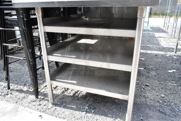 Stainless steel table with multiple under shelves, sturdy frame, suitable for kitchen or industrial use, labeled for organization.