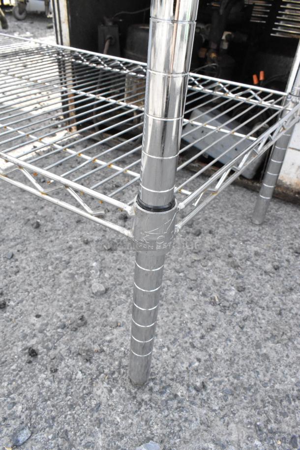 Chrome finish 3-tier wire shelving unit, sturdy construction, dismantling required for shipping, PCI markings on poles.