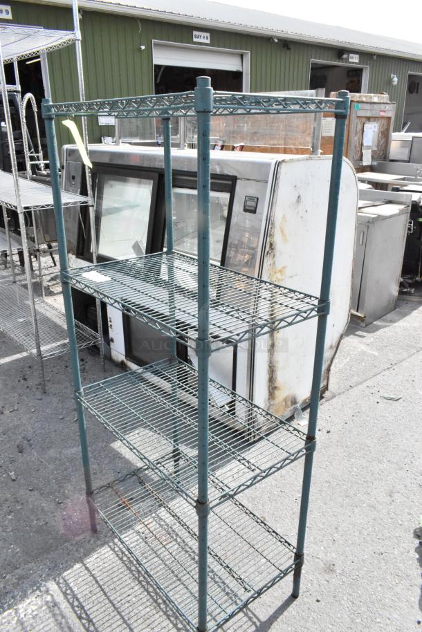 Green finish 4-tier wire shelving unit outdoors. Good condition. Buyer must dismantle before shipping. Freight costs apply.