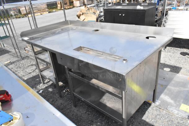 Stainless steel soda station with under shelves, good condition. Features cutouts on top surface, sturdy frame and ample storage.