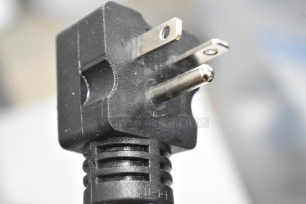 Close-up of a power plug. Descriptive text about the Avantco 184T140 stainless steel commercial toaster is not depicted.