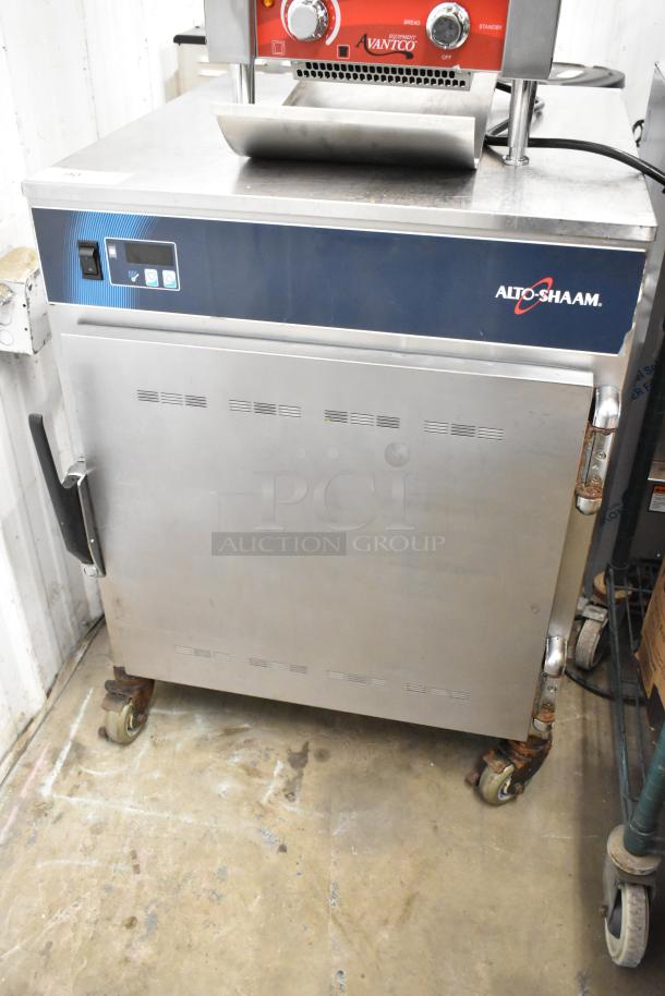 Alto Shaam 750-S stainless steel heated cabinet, commercial casters, 120V, 1 phase, minor wear, visible branding and controls.