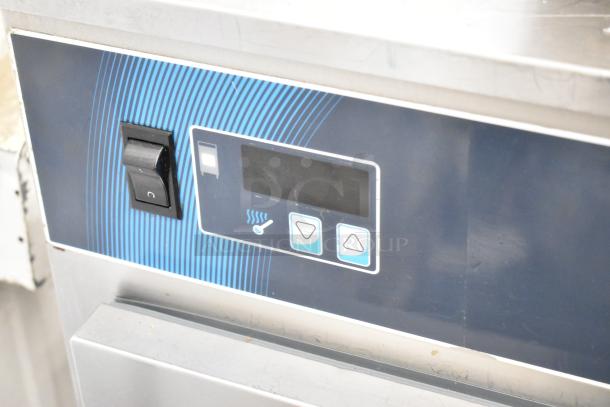 Alto Shaam 750-S heated holding cabinet control panel, features power switch and temperature adjustment buttons.