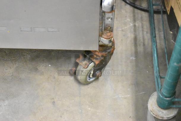 Alto Shaam 750-S stainless steel heated holding cabinet on rusty commercial caster, 120V, 1 phase.