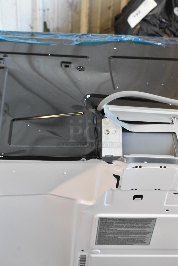 Brand new KoolMore KM-MOT-1SS 1.6 cu. ft. over-the-range microwave, stainless steel, visible surface imperfections.