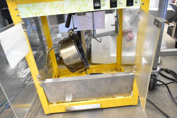 2019 OY-828 Metal Commercial Popcorn Machine, yellow frame, open doors showing popping kettle, 120 Volts, 1 Phase.