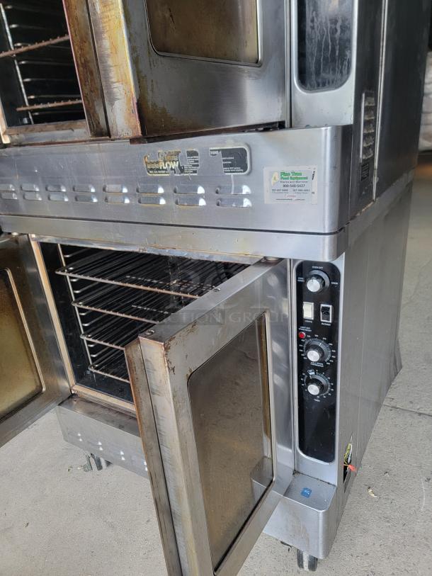 Blodgett DFG-100/200 double convection oven, stainless steel, used condition with visible knobs, labels, and open doors.