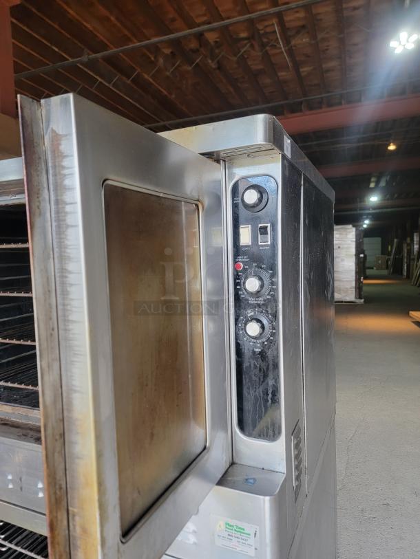 Blodgett DFG-100/200 commercial double convection oven, stainless steel, visible control knobs, good condition. Ideal for kitchens.