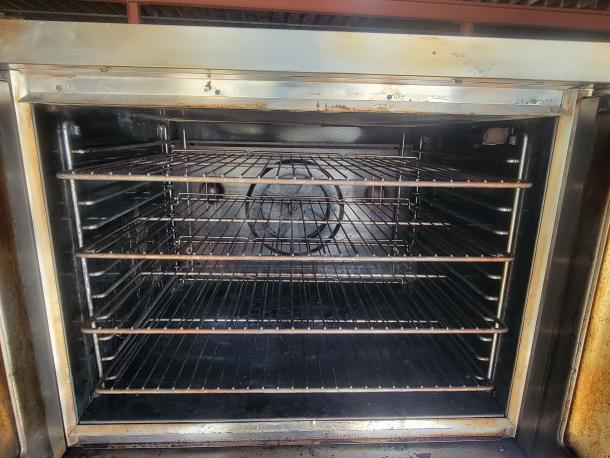 Blodgett DFG-100/200 double convection oven interior, displaying multiple wire racks, in used condition. Ideal for commercial kitchens.
