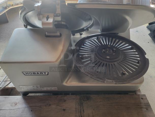 Hobart Model 3913 commercial meat slicer, heavy-duty, silver finish, visible Hobart label, sturdy metal construction.