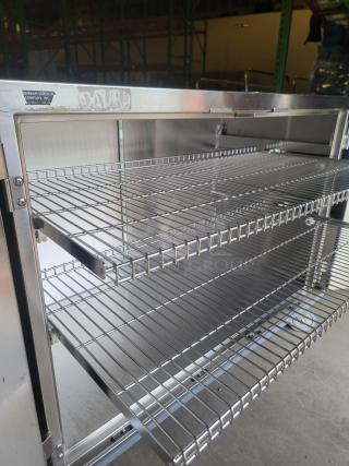 Stainless steel mobile case cart by Suburban Surgical, Model Tote-AL Type C, open shelves, industrial-grade, durable construction.