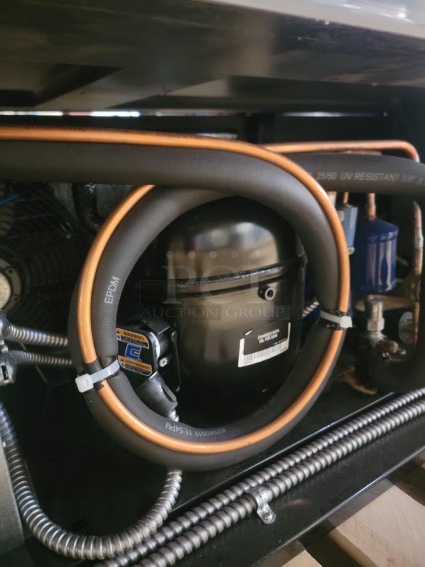 RPI SCRFC7278R Air Screen Merchandiser compressor detail, showing wiring and UV resistant tubing. Ideal for chilled displays.