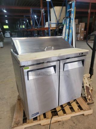 Turbo Air MTS-36-NS refrigerated 36" prep table on casters, stainless steel, spacious worktop, refrigerated storage, good condition.