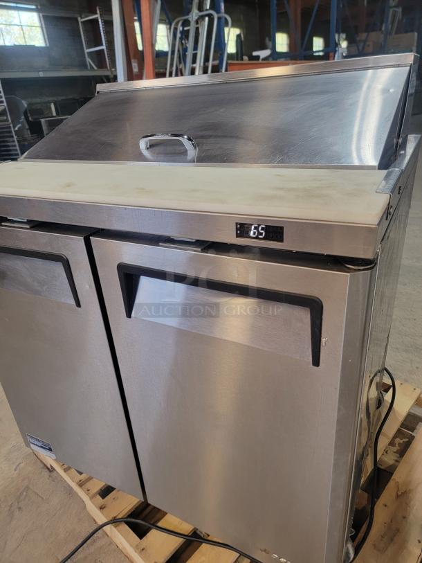 Turbo Air MTS-36-NS refrigerated prep table, stainless steel, casters, digital display, excellent for kitchen efficiency.