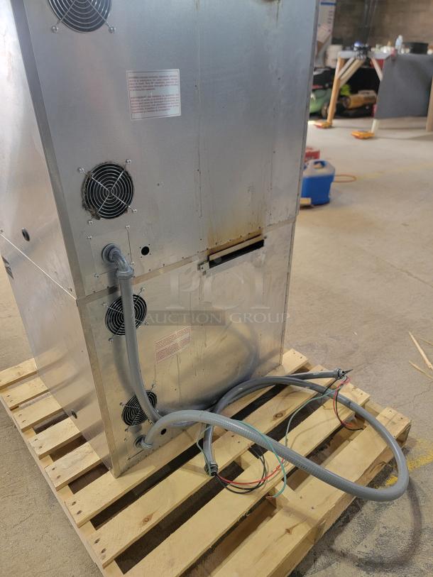 Blodgett CTB-1 double convection oven on a pallet; features power cables and ventilation fans; metal finish, good condition.