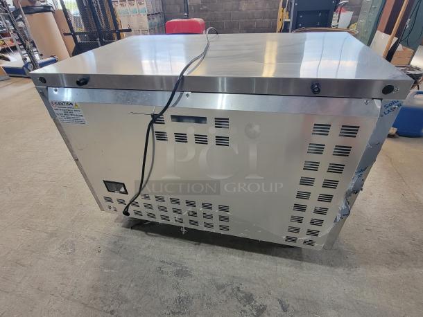 Continental SW48N 48" worktop refrigerator, tested and working, stainless steel, with safety labels showing voltage and warnings.