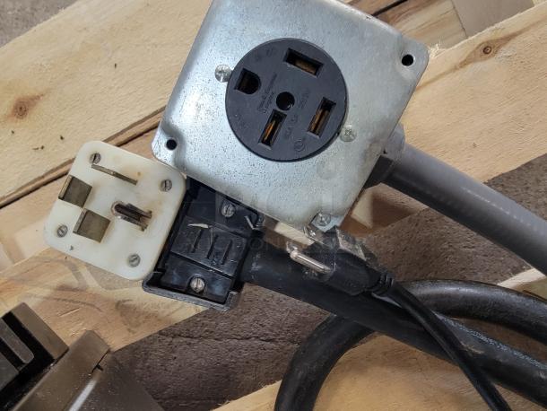 Electrical plug and outlet connected to the Blodgett BLCT-6E-H Combi-Oven, showing the power configuration.