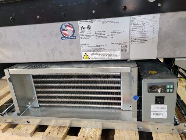 Structural Concepts Reveal NE3627RSV refrigerated slide-in counter display case, tested and working. Labels show model and specs.