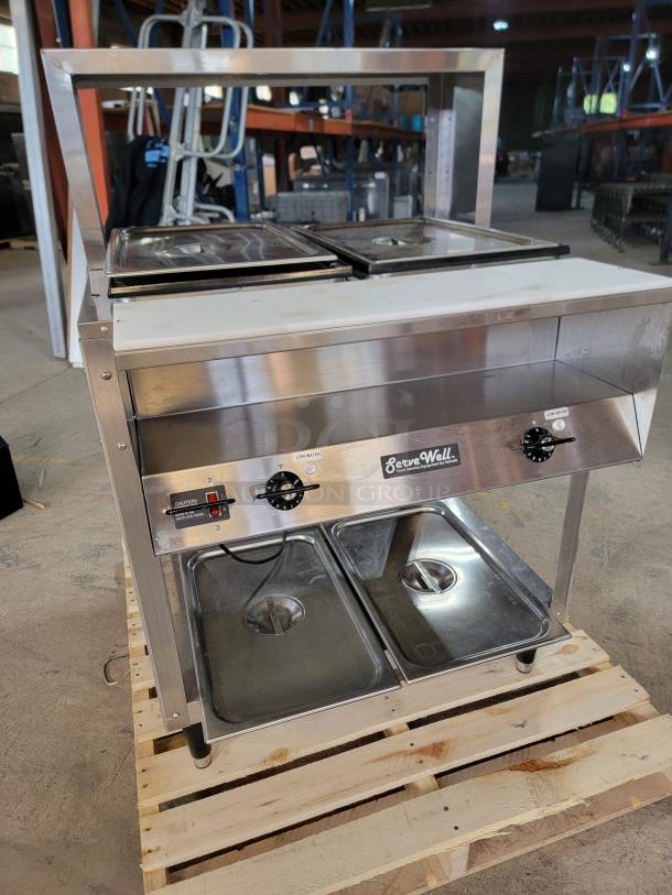 Vollrath ServeWell Steam Table Model 38002 in great condition, stainless steel, dual temperature controls, mounted on a pallet.
