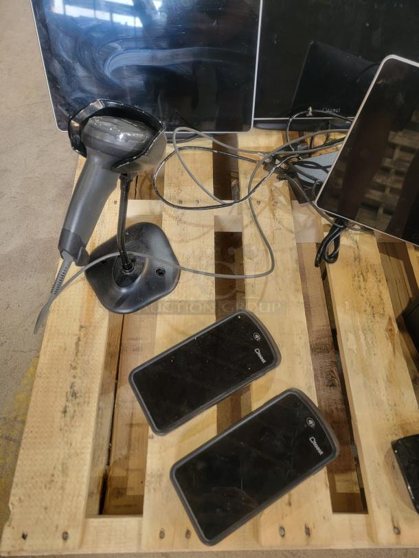 Toast POS system with screens, barcode scanner, and handheld devices on a pallet. Ideal for restaurant use, good condition.