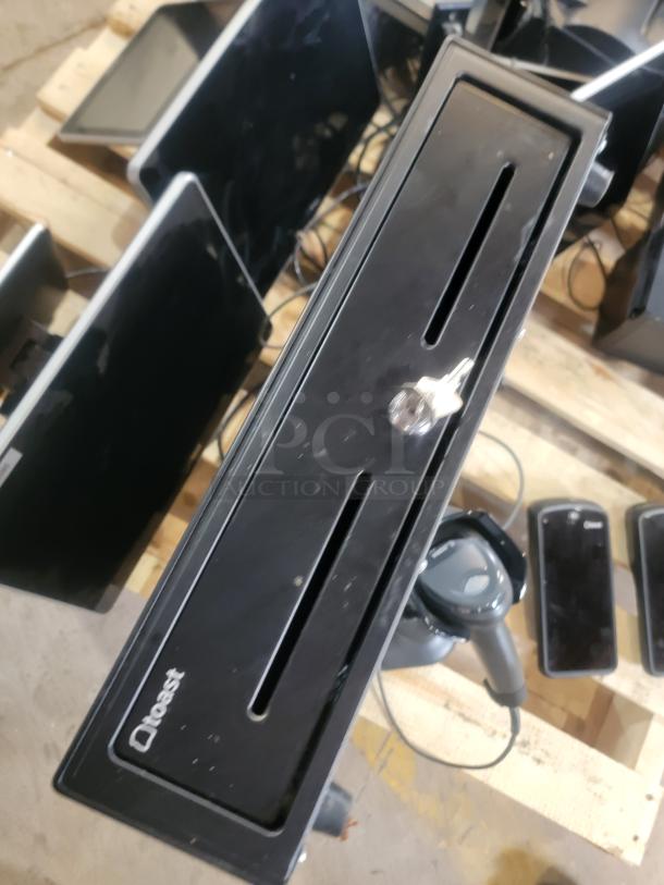 Toast POS System, complete restaurant package, shows a cash drawer with key, card readers, and screens, all in good condition.