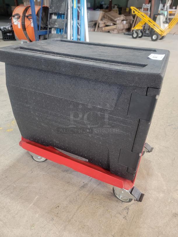 Cambro EPP300 insulated food pan carrier on red dolly, black EPP material, excellent condition, maintains temperature for 4 hours.