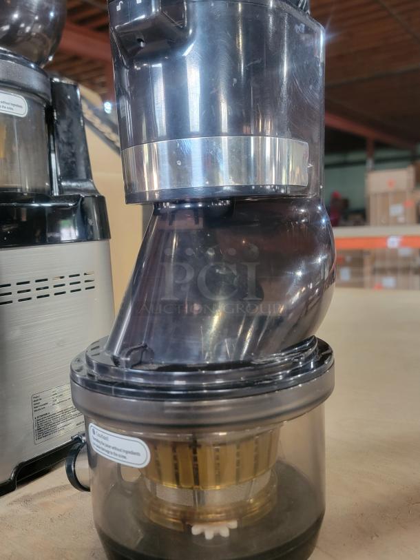Kuvings CS600 Commercial Cold Press Juicer in excellent condition, featuring durable plastic and metal components, ideal for high-volume juicing.