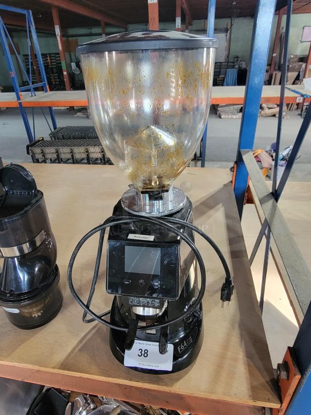 Fiorenzato F64 Evo espresso grinder with digital display; signs of use visible in hopper. Auction tag "38" attached.