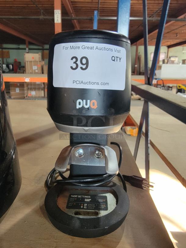 PUQpress mini (GEN 5) automatic coffee tamper, Model 7-000-0400-1. Professional-grade, excellent condition, adjustable tamp settings visible.