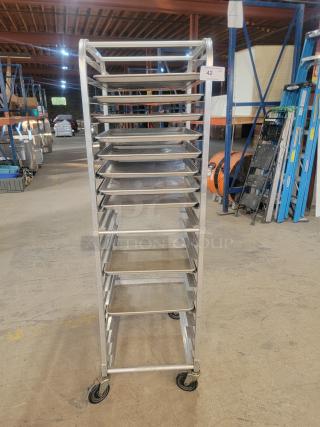 Regency 18-pan full-size aluminum mobile bun pan rack, showing some wear. Ideal for commercial kitchens.