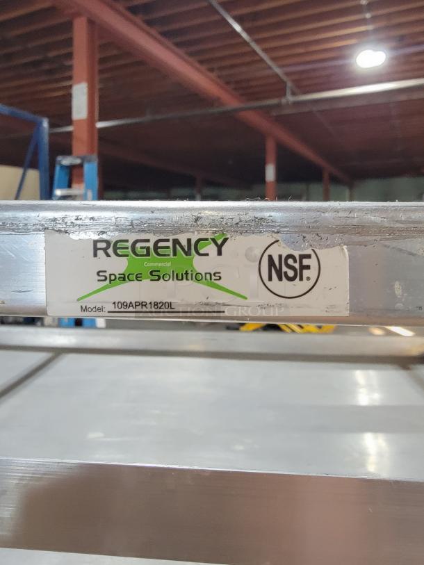 Regency 18-pan aluminum bun pan rack, model 109APR1820L, NSF certified. Shows normal wear, fully functional for commercial use.