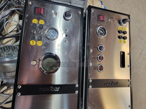 Modbar Espresso AV & Steam Package, model MB003074/MB003120. Sleek stainless steel design, controls, and gauges visible.