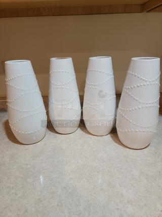 Set of four 12" Hosley white textured ceramic vases. Elegant design for home or restaurant decor. Excellent condition.