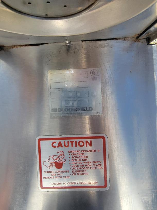 Bloomfield Integrity Commercial Coffee Maker Model 9003; safety cautions visible, stainless steel, good condition.