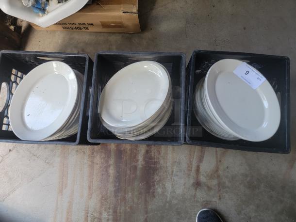 Large lot of Homer Laughlin ivory platters with rolled edges in crates, ideal for commercial use. Original price $340/dozen.