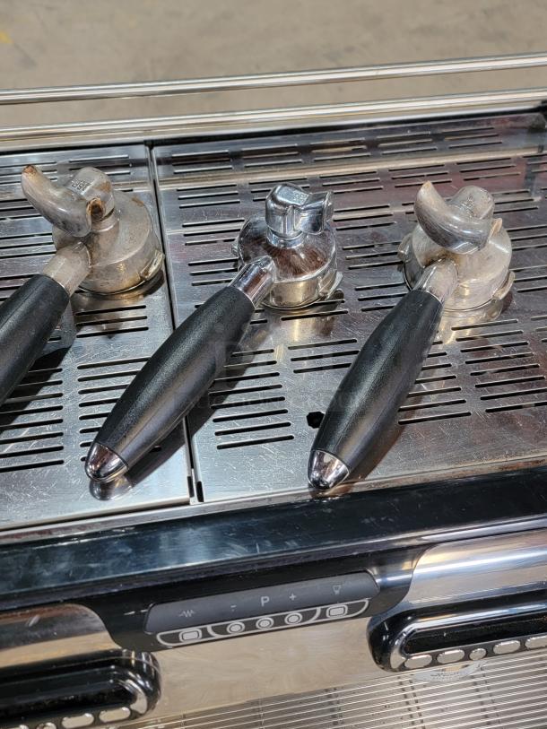 La Spaziale 2-Group espresso machine, black handles, stainless drip tray, barista ready, for commercial use.
