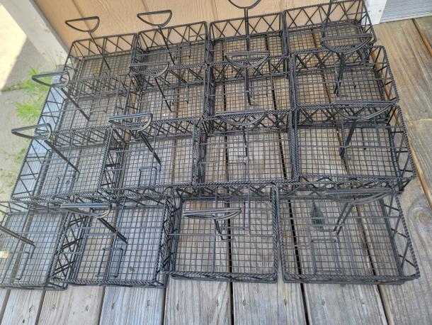 Lot of 16 black metal 5-compartment condiment caddies, durable and perfect for restaurant table organization.