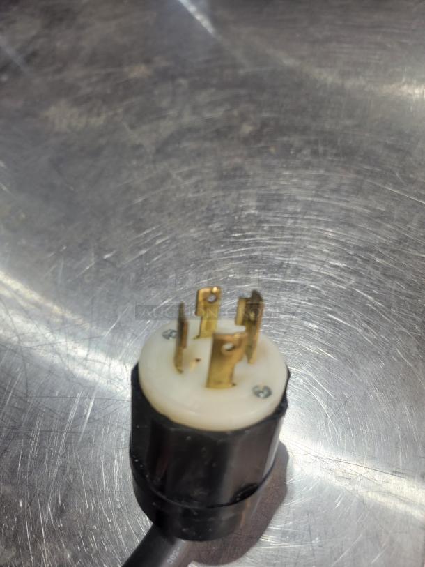 Power plug for TurboChef HHS 9500-14-DL Double Batch high-speed oven. Features sturdy metal prongs and durable casing.