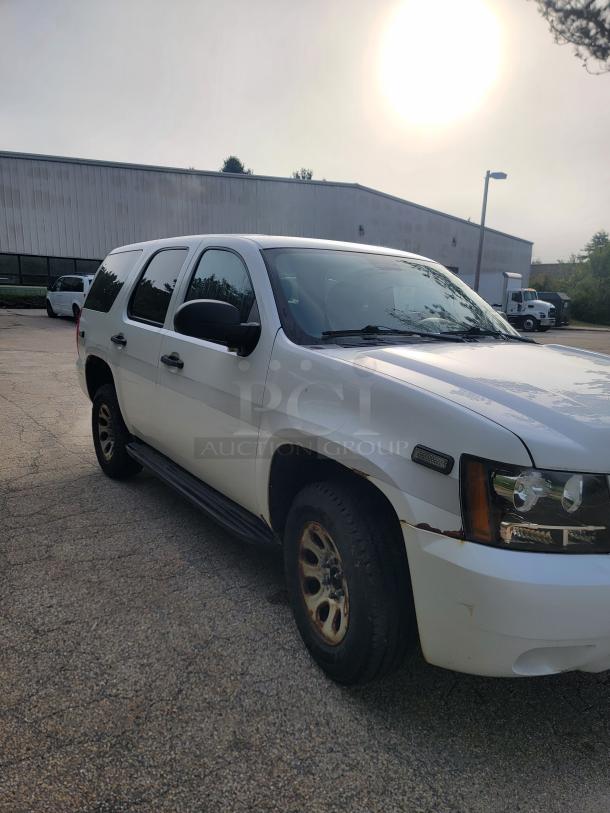 White 2012 Chevrolet Tahoe 4x4 SUV, 136,880 miles, ex-emergency vehicle, new battery and alternator, inspected, durable.