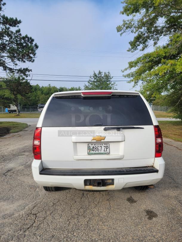 White 2012 Chevrolet Tahoe 4x4 rear view, well-maintained, new battery and alternator, September inspection sticker.