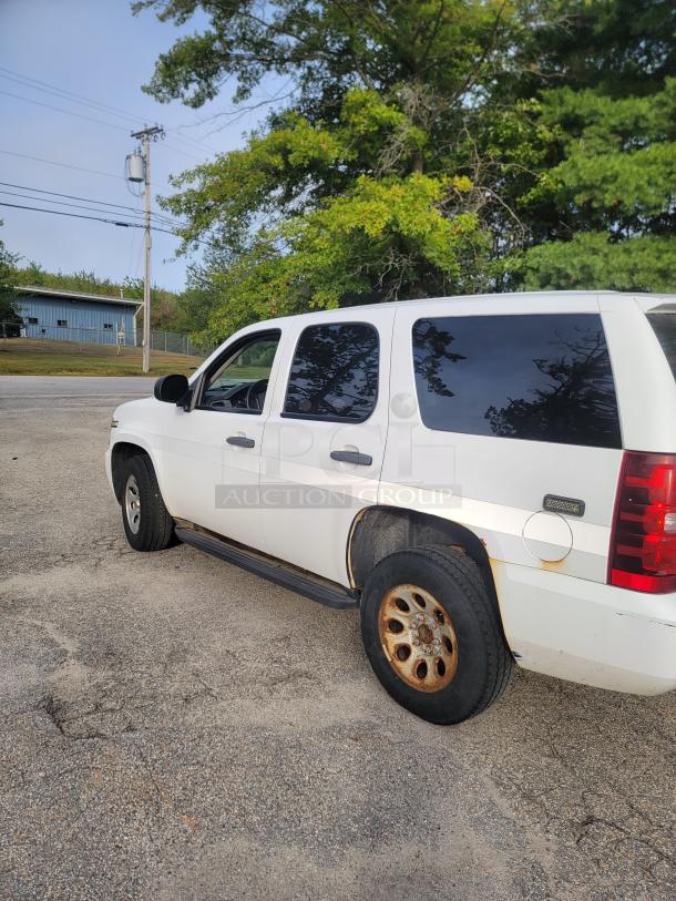 White 2012 Chevy Tahoe 4x4 SUV, ex-emergency vehicle, 136,880 miles, new battery, alternator, current inspection.