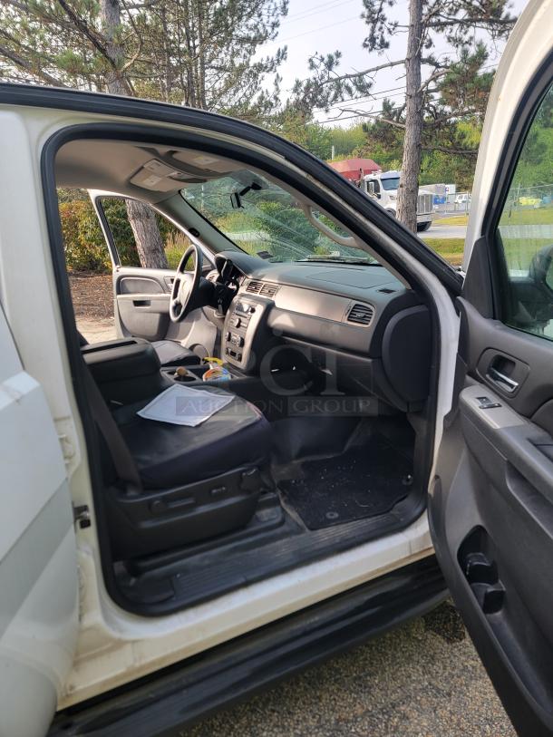 2012 Chevy Tahoe 4x4 interior view, white exterior, fleet-maintained, 136,880 miles, new battery and alternator, inspection ready.