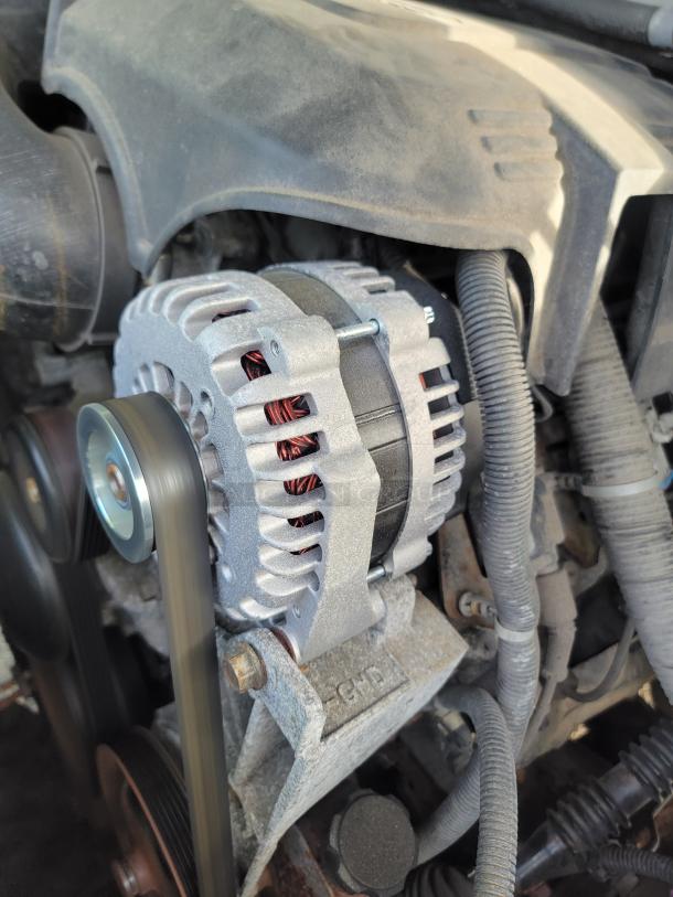 New alternator installed in the 2012 Chevrolet Tahoe engine, showcasing clean components and reliable maintenance.