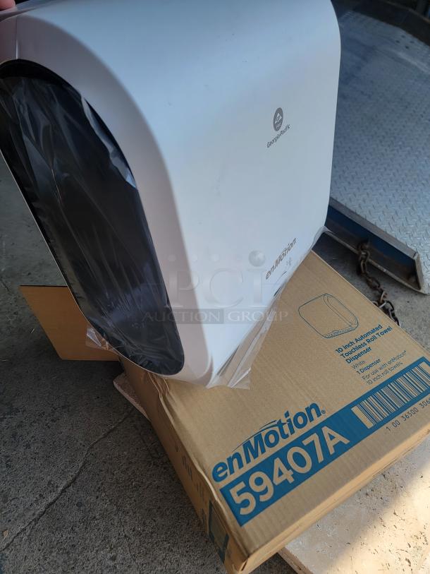 Brand new Georgia-Pacific enMotion 59407A touchless paper towel dispenser, set of two, boxed. Perfect for hygiene efficiency.